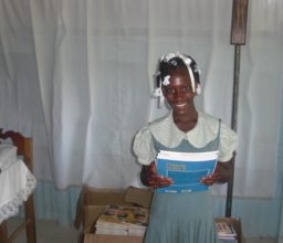 Happy student with new books