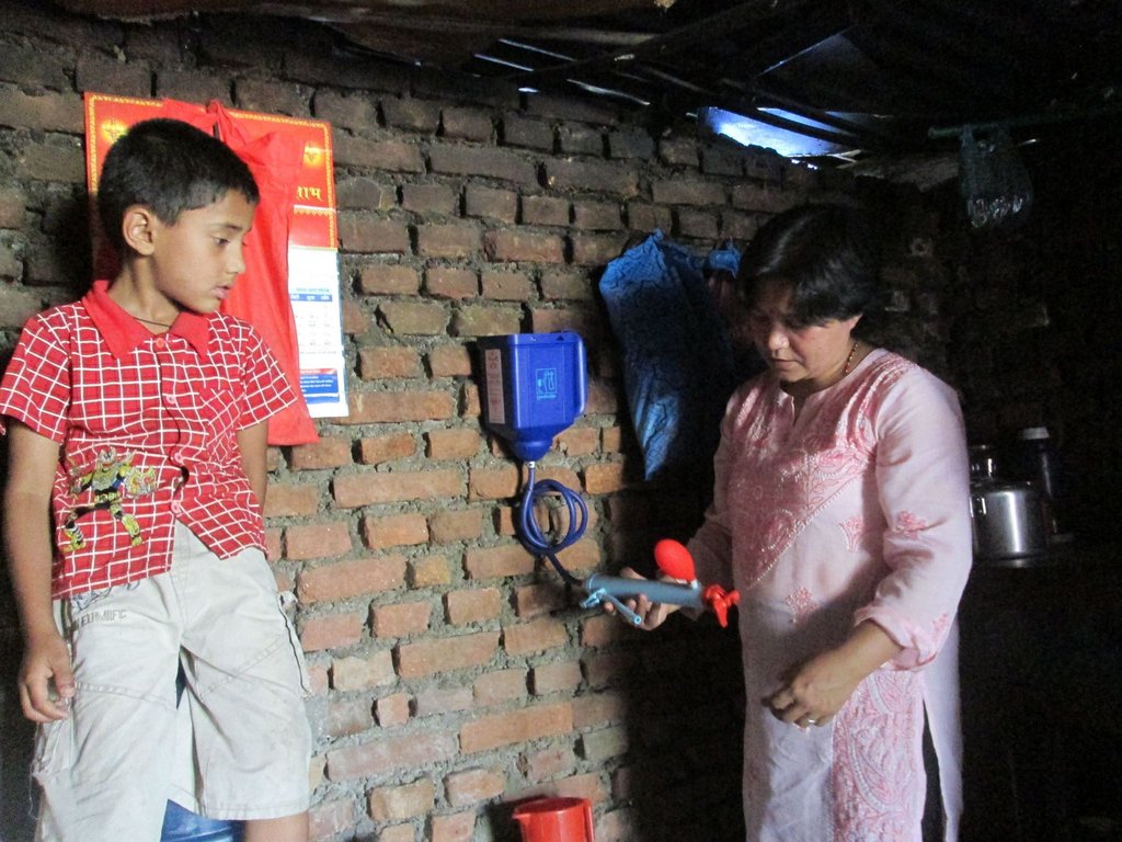 Mother and child with new water filter