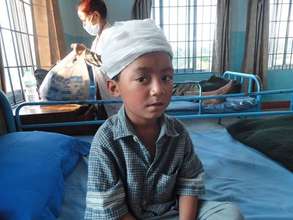 Young boy with head injury in NYF recovery clinic