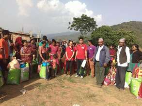 TFN Fellows with community members at distribution