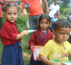 school children with stationery kits