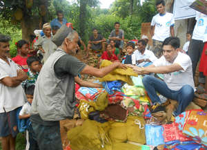 Relief Material Distribution to victims at a camp