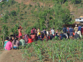 A crowd gathers, awaiting relief
