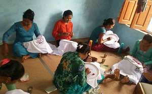 Wives of the disappeared at work on embroidery