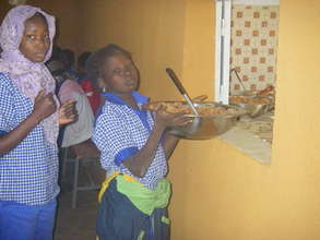 Girls serving the noon meal.