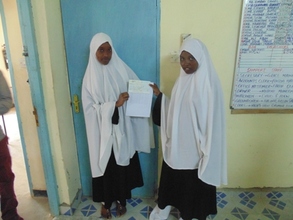 Amran  right and Anfaa left receiving their cheque