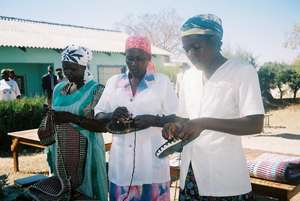 Mother Support Group members making shoes