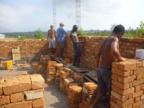 Construction team brick laying