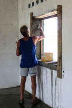 International volunteer (Bob) working on a window