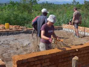 International volunteer working on school build