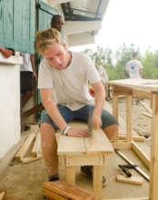 Geert nails a bench together