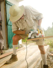 Jim cuts up wood for benches