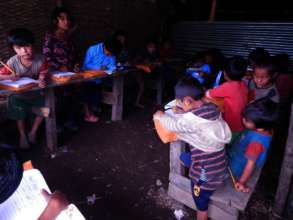 Children in the temporary school constructed by SASANE.jpg