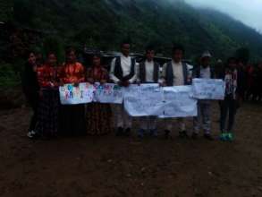 Villagers with the posters against Human Trafficking.jpg