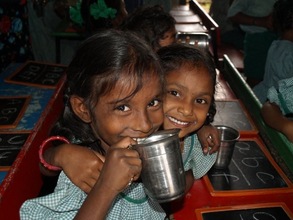 Milk distribution at our literacy center in Kandrika