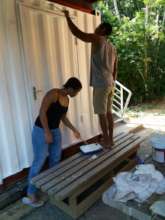 Two volunteers painting the IC unit