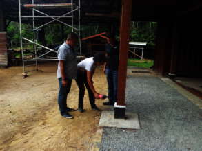 Pouring libation to bless building stage