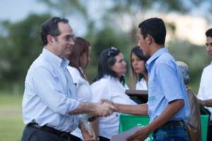 Students receive diplomas from Martin Burt