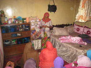 Halima laughs with her students