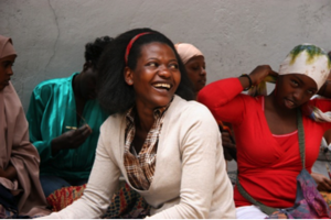 Euphrozine laughing with friends.