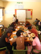 Girls' writing articles for their newsletter