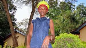 Loice wearing DIY Overalls and a safety helmet