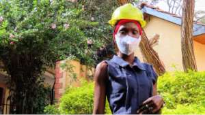 Loice wearing a face mask at the RefuSHE campus