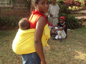 Miriam helping out with a Heshima friend's baby.