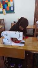 Solange attending her tailoring class at the GEP