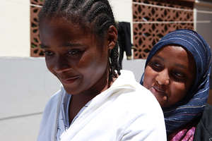 Miriam with Hamdi, a Heshima Caseworker.