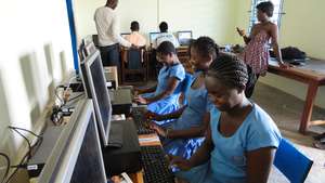 Girls enjoying their first computer class