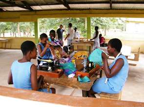 Girls in a dressmaking exam