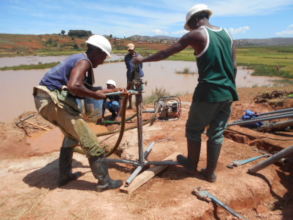 Borehole drilling team in action