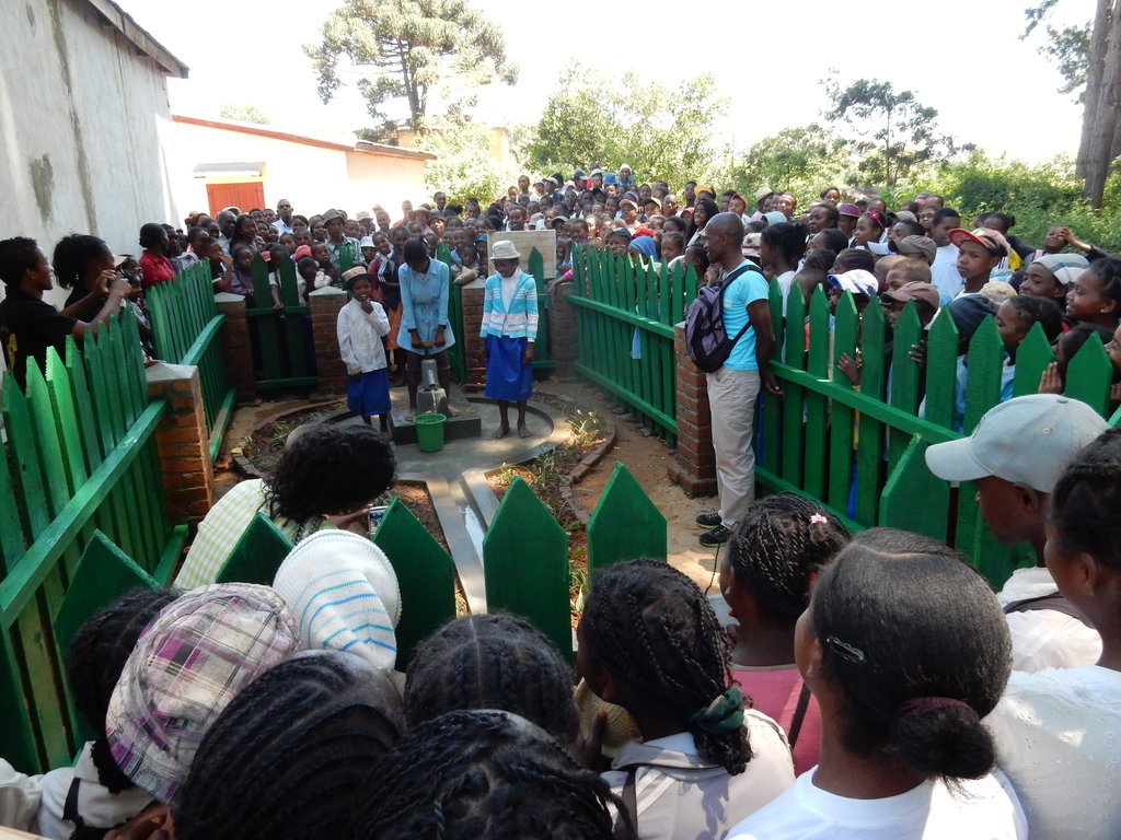Secondary school children with their new borehole