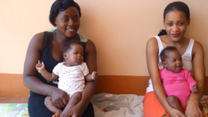 Sisters enjoying loving attention from the Aunties