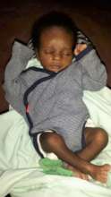 Mercy safe in her cot.