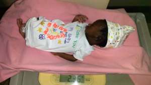 Mercy in her babygrow.