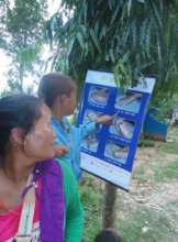 A boy looks at a poster on handwashing