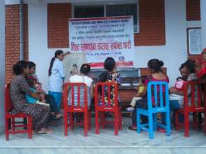 A nurse teaches mothers about breastfeeding