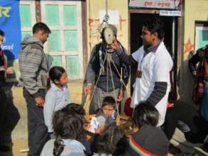 Child getting weighed at an outreach clinic