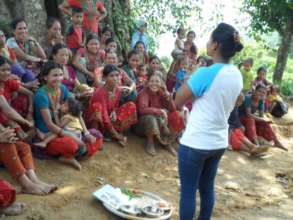Educator teaching mothers on proper nutrition