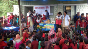 Children and mothers at a nutrition outreach camp