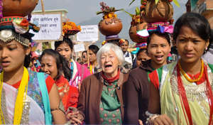 Olga Murray marching with freed Kamlari