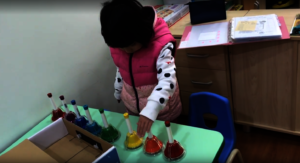 Tina loves to play handbells.