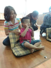 Kevin with mother behind