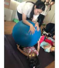 Roll big ball downwards towards my body