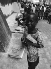 Gloria & Aaron receiving school supplies.