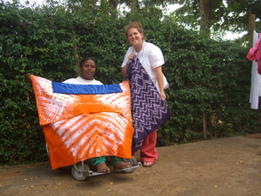 Scolnik, Project Coordinator, poses with Hllda Shoo, a KASI memb