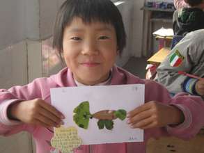 Student shows off her creation proudly.