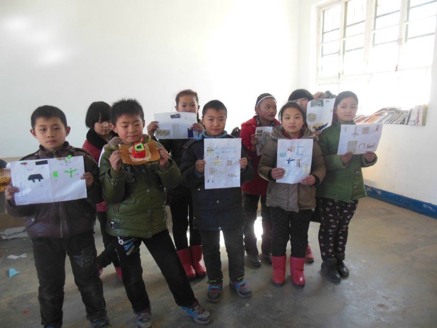 Students show off their own blueprints.